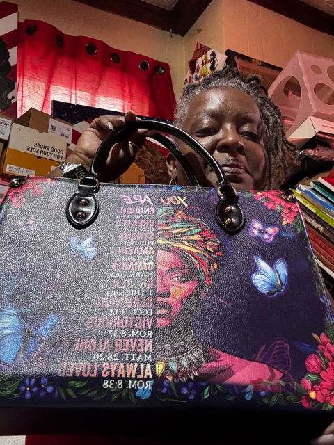 Customer photo from Doris Arnett-Gary's review of /products/imani-blue-orchid-leather-handbag