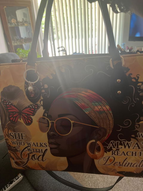 Customer photo from Victorious's review of /products/imani-blue-orchid-leather-handbag