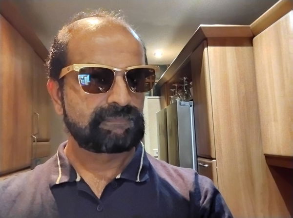 Man wearing Ray-Ban Wayfarer Deluxe sunglasses