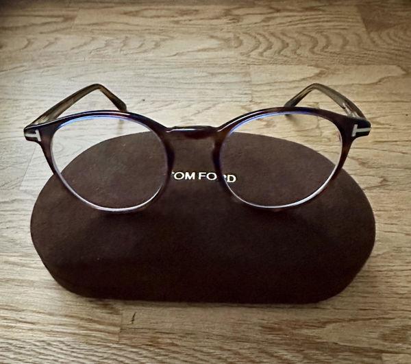 Tom Ford glasses on their case