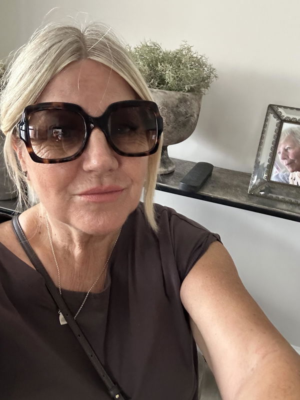 Woman wearing Gucci sunglasses