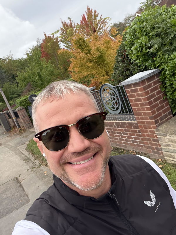 Man wearing Ray-Ban Clubmaster sunglasses