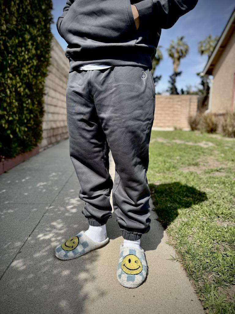 Customer wearing the gray Armor of God joggers