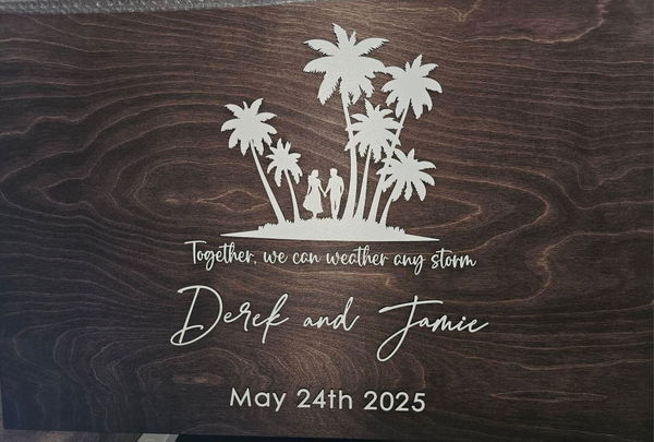 Customer photo: a dark wooden guest book board with a palm-tree design, two first names and a wedding date