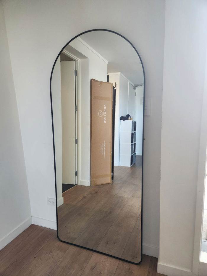 Titan X Arched Full-Length Mirror in a customer's home