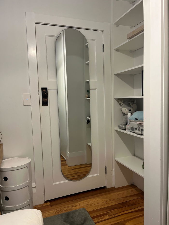 Eclipse Oval Frameless Full-Length Mirror in a customer's home
