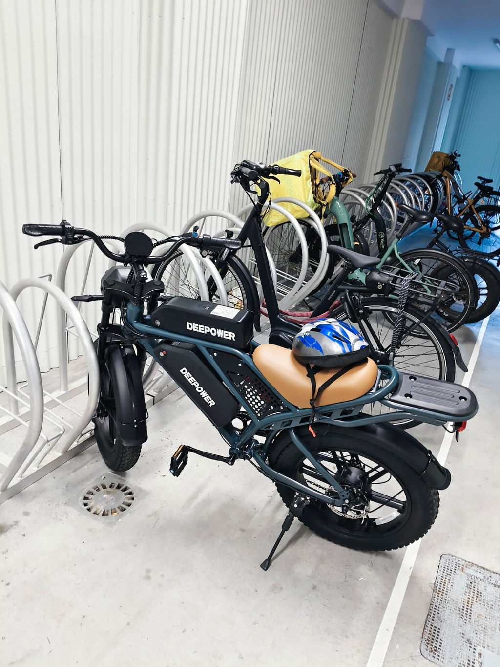 Alex's DEEPOWER bike parked in a bicycle storage area