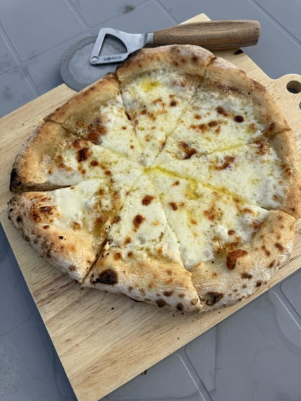 Pizza made by a Dough Dorks customer