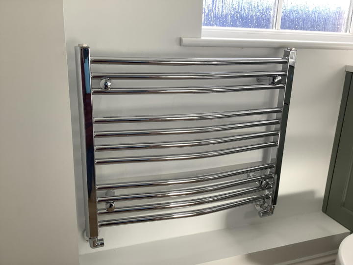 Customer photo: 600 x 750 curved chrome rail installed in a bathroom