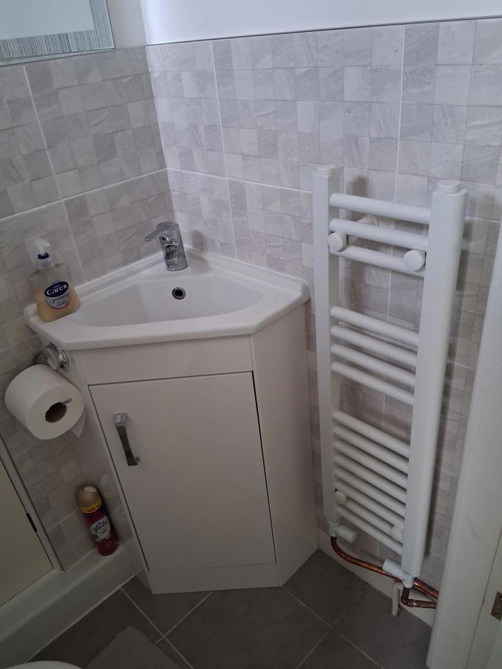 Customer photo: 800 x 250 white towel rail installed in a bathroom