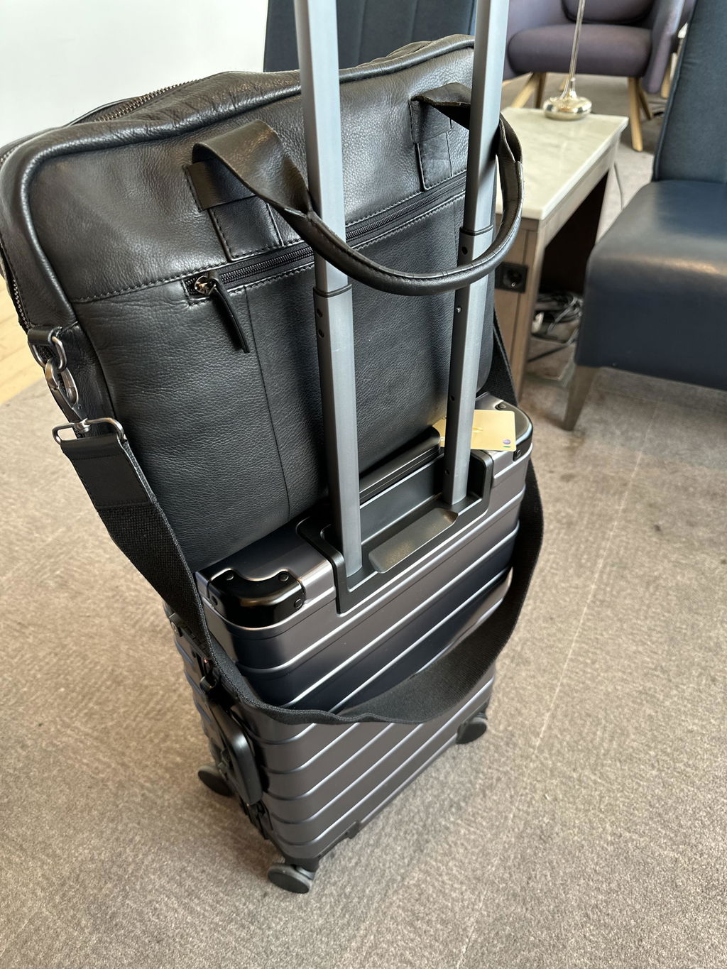 Steven's Gunmetal Grey FORTE Cabin with a leather bag on the handle