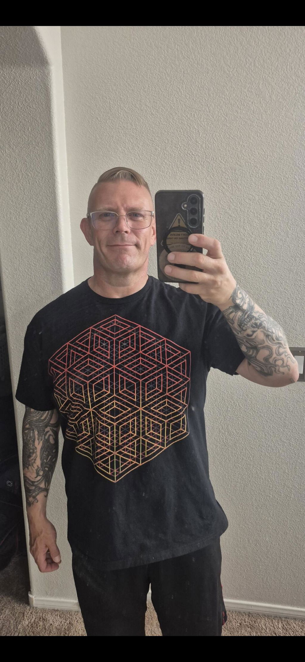Brian wearing his black 3D Wireframe Cube Regular tee