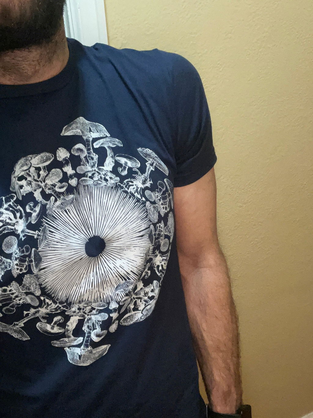 Customer photo showing the Mushroom Iris print on a navy Regular tee
