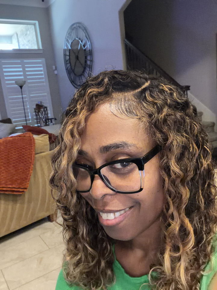 Customer photo attached to a verified purchase review of Brazilian Deep Curly 4X4 HD Lace Closure