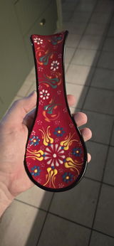 The little red spoon holder that's amazing