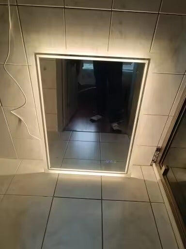 Customer photo of a rectangular illuminated mirror