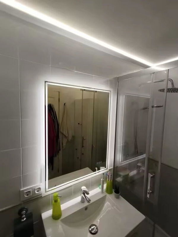 Customer photo of a rectangular illuminated mirror above a basin beside a shower