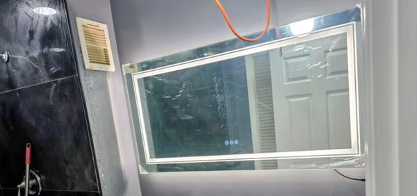 Customer photo of a rectangular double light mirror mounted above a bathroom basin