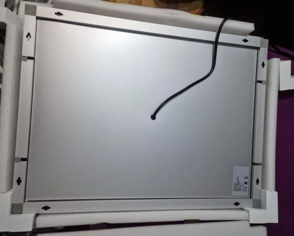 Customer photo showing the rear of a rectangular mirror in protective packaging