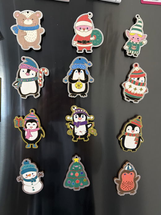Painted wooden Christmas ornaments made by a customer