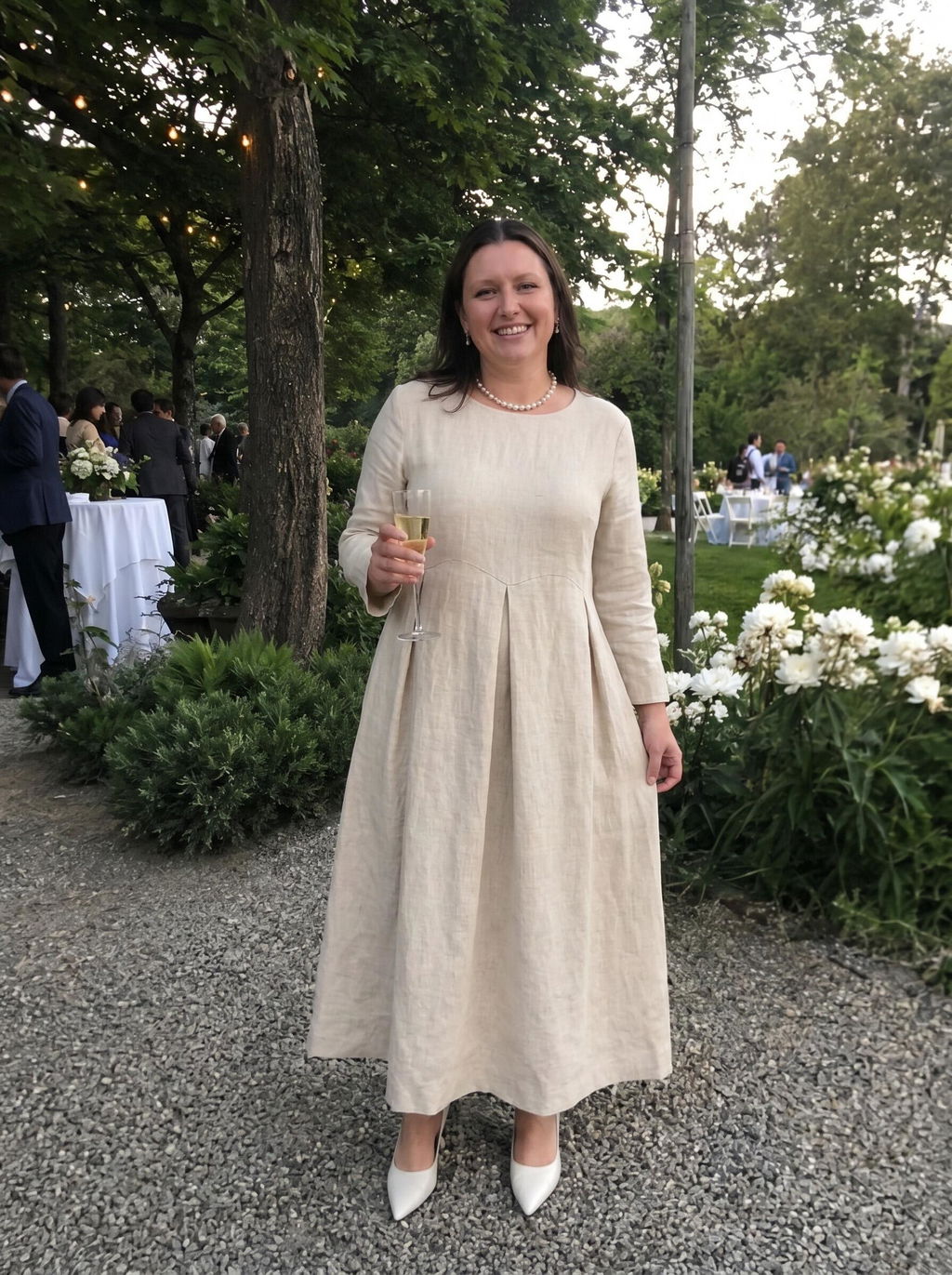Customer wearing the bateau neck pleated dress