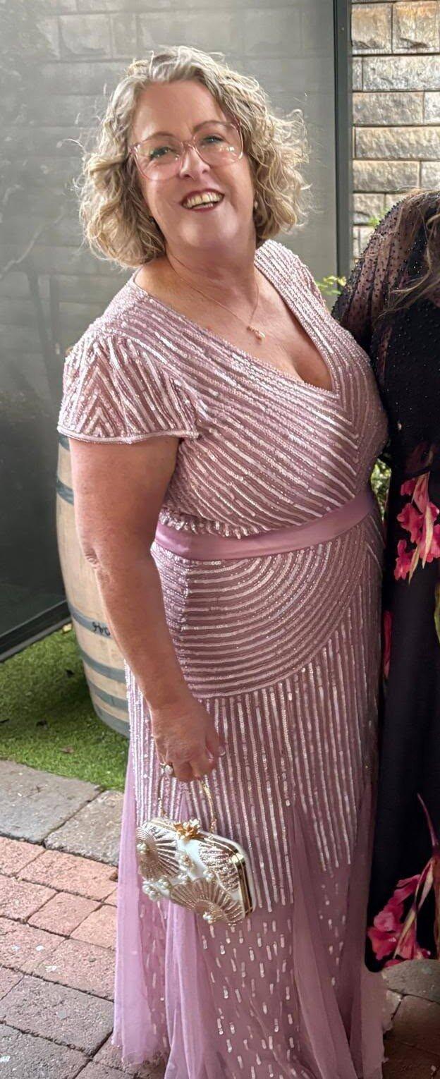 Customer styling the Floral Dream Pearl Clutch with her Mother of the Groom dress