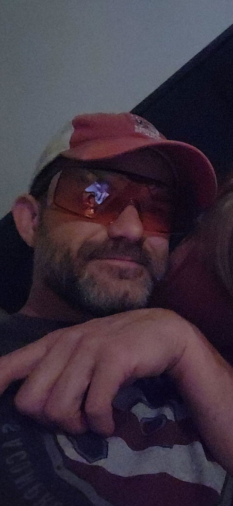 Customer photo from a review of OverSpecs+ Tinted Over-Glasses Safety Sunglasses