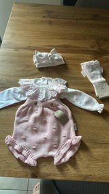Pagliaccetto neonato in cotone pompon con voulant