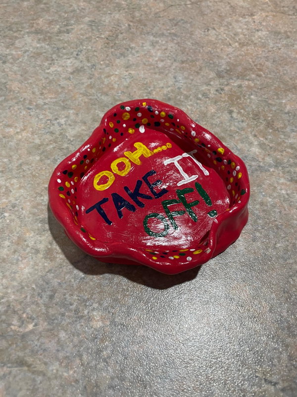 Red painted clay piece