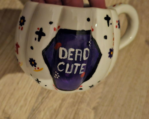 A pumpkin mug painted by a customer.