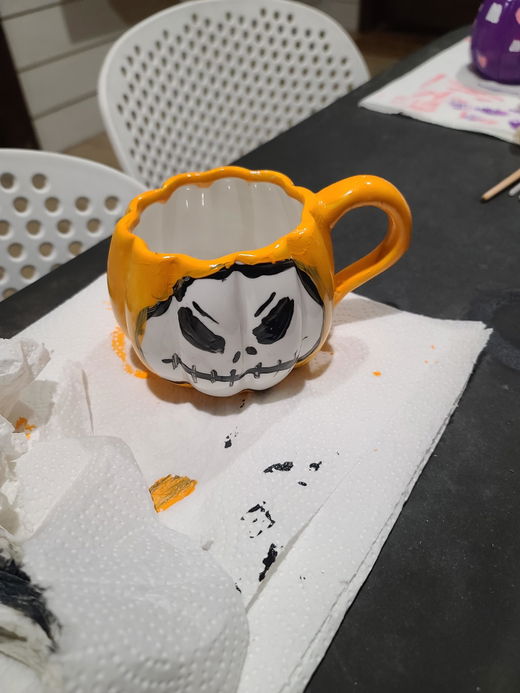 A pumpkin mug painted by a customer.