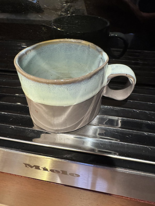A hand built clay mug