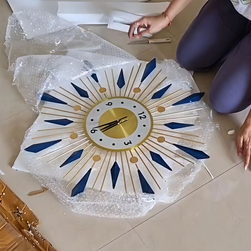 Blue with golden sunburst Wall Clock