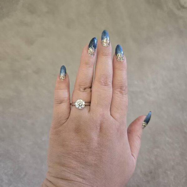 Customer photo of a round brilliant six-prong solitaire ring