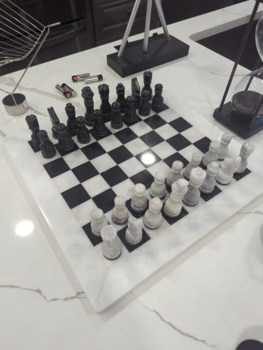 Customer photo of a Royal Bishop marble chess set shared by Flor