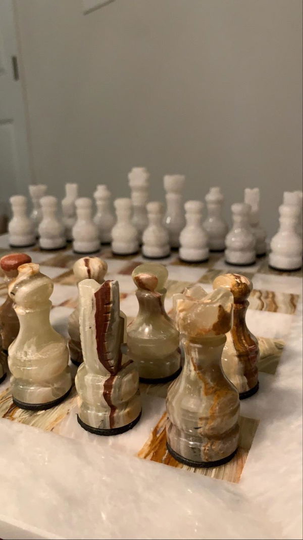 Customer photo of onyx chess pieces showing natural veining