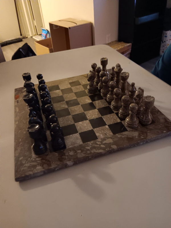 Customer's marble chess set on a table at home