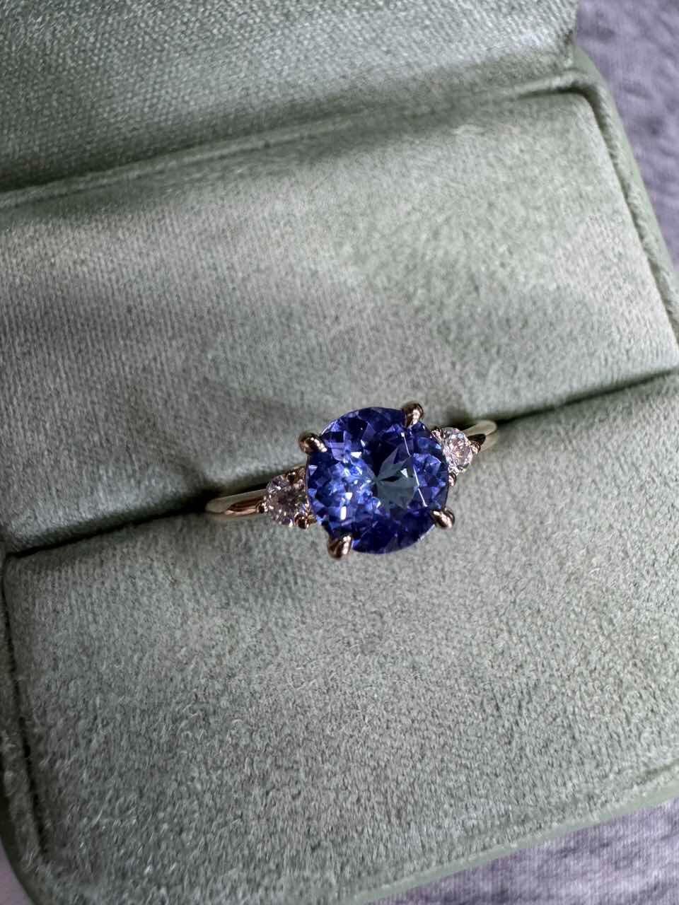 Theodora’s Twilight | Round-Cut Tanzanite Vintage Three-Stone Engagement Ring