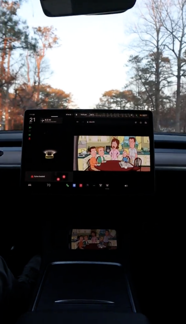 Customer photo of phone screen mirroring on a Tesla display via the Space Box