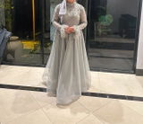 ‘EVELYN’ GREY HIGH NECK BALL GOWN WITH FEATHER CUFFS