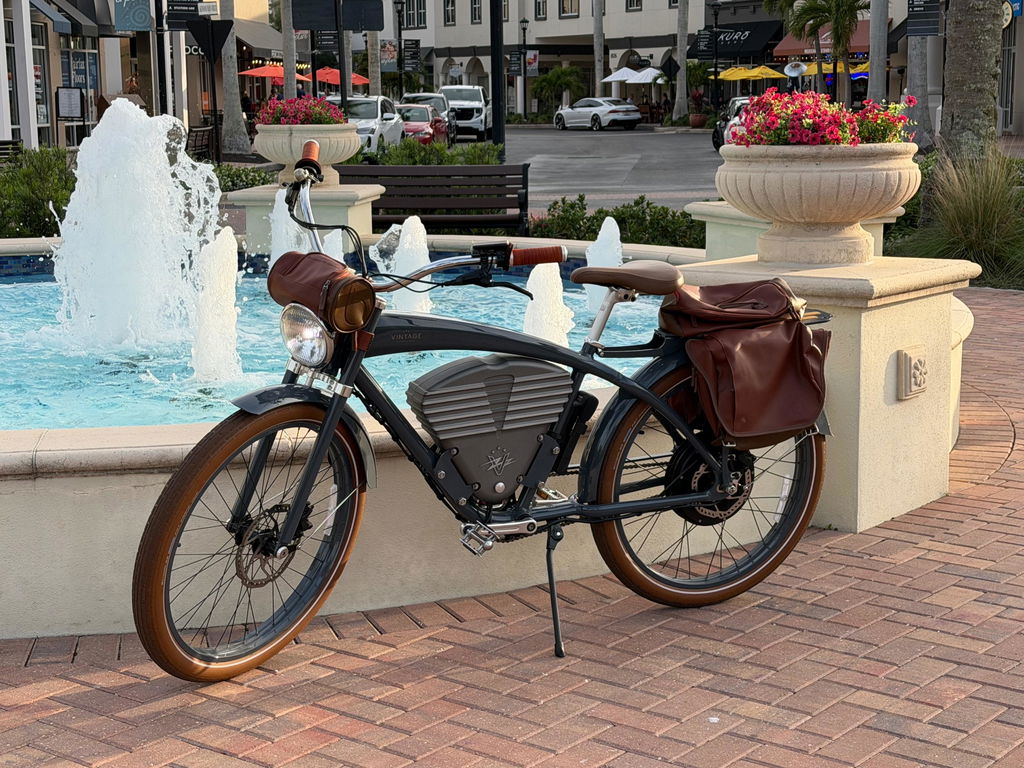 Customer photo of a Tracker Classic with leather bags beside a fountain