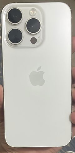 Buyer’s photo: back of a white titanium iPhone 15 Pro