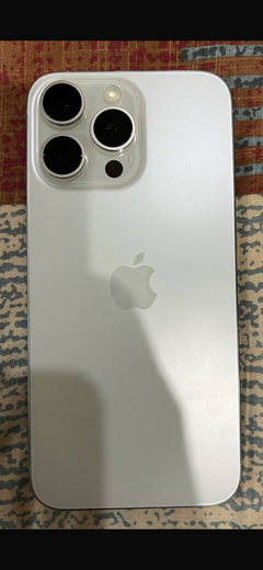 Buyer’s photo: back of a white titanium iPhone 15 Pro Max