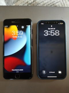 Buyer’s photo: the iPhone 12 Pro on the lock screen next to the buyer’s old iPhone