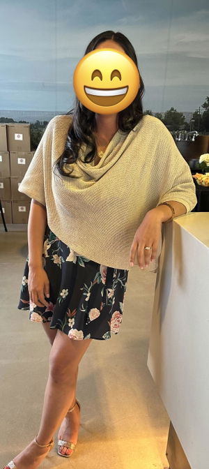 Lilian wearing the Natural Cocoon over a floral skirt