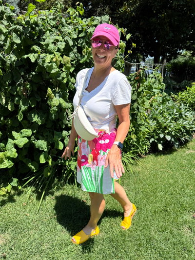Customer wearing Sunshine Yellow Peep Toes outdoors with a floral skirt